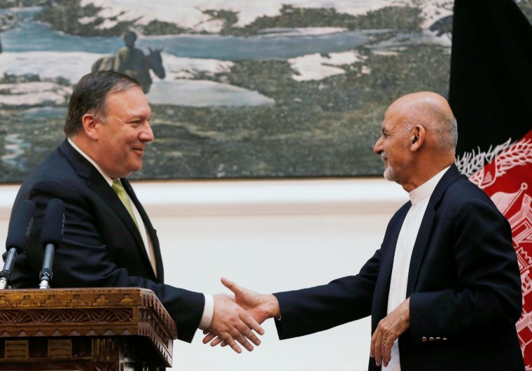 Image: Afghan President Ashraf Ghani, and U.S. Secretary of State Mike Pompeo, shake hands during a news conference in Kabul, Afghanistan