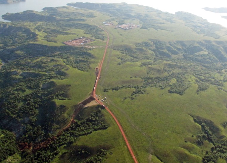 Image: Discolored vegetation, lower left, leading from a pipeline where an estimated 1 million gallons of saltwater spilled from an underground pipeline