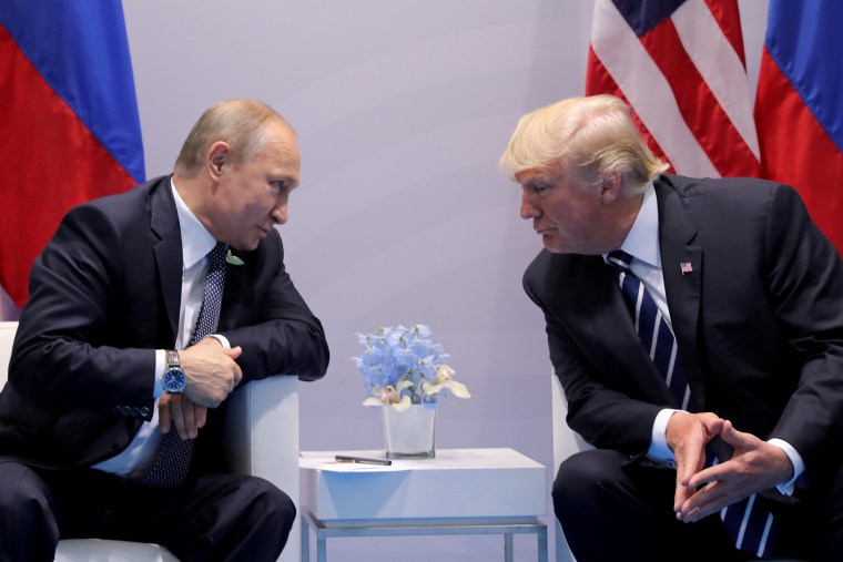 Image: Russia's President Putin talks to U.S. President Trump during their bilateral meeting at the G20 summit in Hamburg