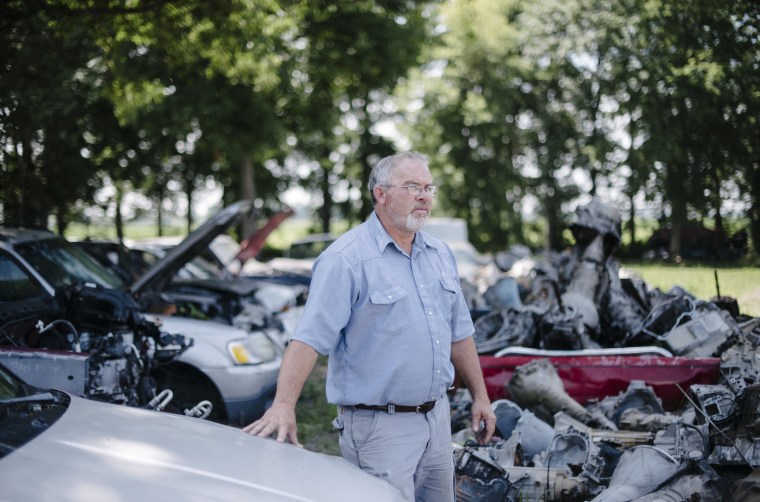 Image: Billy Redwine in the car yard of his family's auto parts business