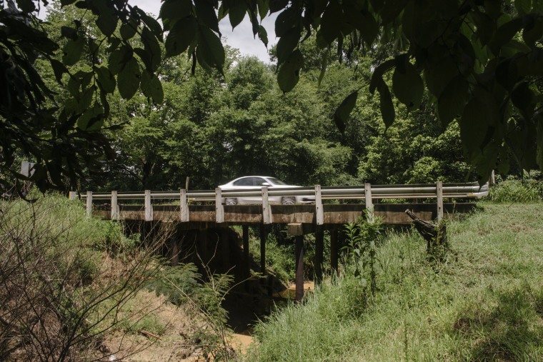 Image: A car passes over a newly reopened bridge in Hinds County