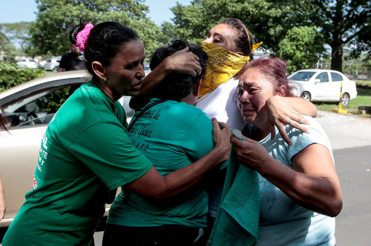 Image: Relatives embrace an university student who was freed after being trapped overnight in Divine Mercy Catholic Church where they took shelter as pro-government gunmen shot at them, in Managua