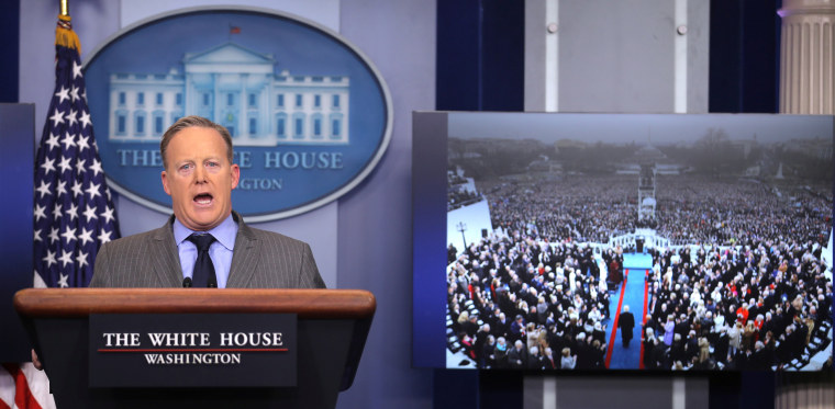 Image: Press Secretary Sean Spicer delivers a statement while television screen show a picture of U.S. President Donald Trump's inauguration at the press briefing room of the White House in Washington U.S.