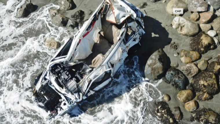 Angela Hernandez's car rests at the bottom of a cliff in Big Sur, California.