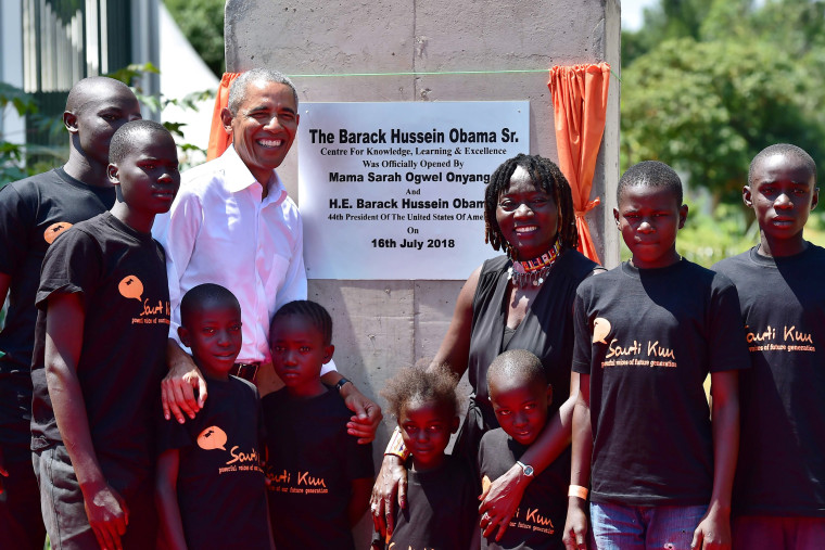 Image: Obama greets kids during the opening of the Sauti Kuu Resource Centre