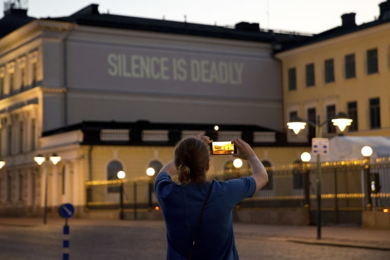 Image: A screen projected sign is seen next to the president's castle