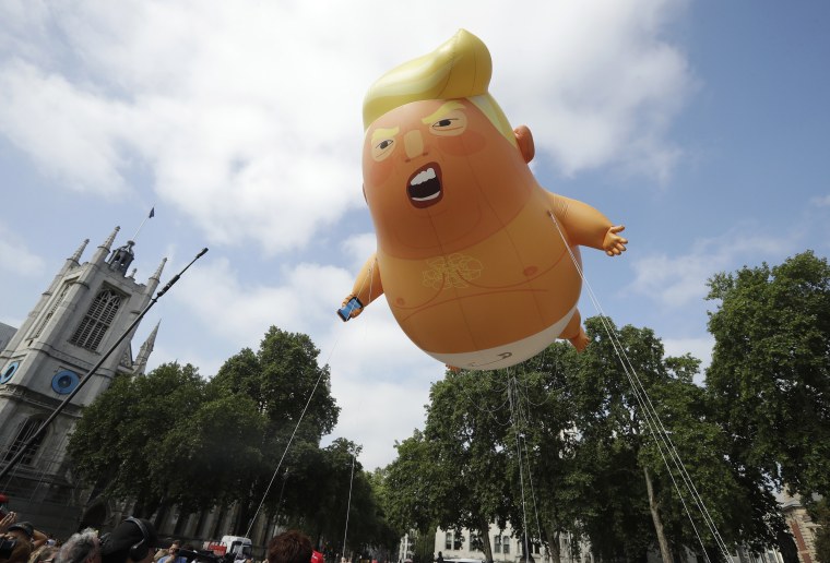Image: A cartoon blimp of President Donald Trump