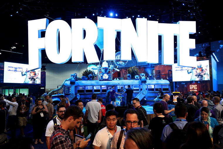 Image: Game enthusiasts and industry personnel visit the 'Fortnite' exhibit