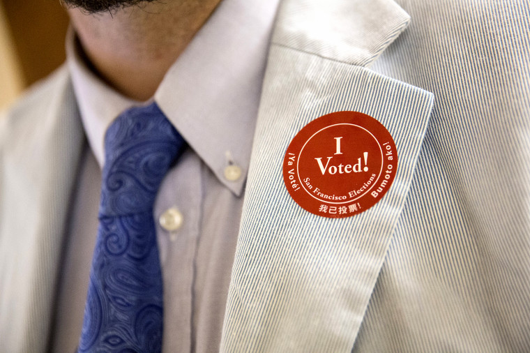 Image: A man wears a "I Voted!" sticker after voting in the California primary on June 7, 2016 at City Hall in San Francisco.