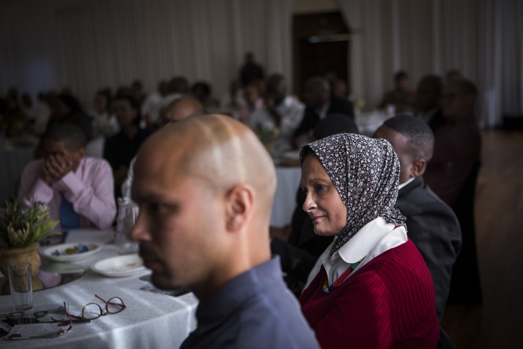 Members of the community listen to speeches during the launch of the Prison to Pipeline program offering in person college courses in prison to facilitate re-entry, on the centennial of Nelson Mandela's Birthday at Brandvlei Correction Centre in Worcester