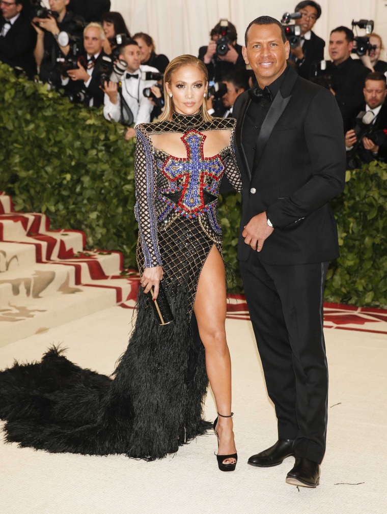 Jennifer Lopez and Alex Rodriguez pose on the carpet at the 2018 Met Gala 