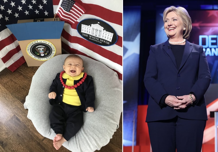 Baby Liberty dressed as Hillary Clinton, former first lady, senator, secretary of state, and Democratic presidential nominee.
