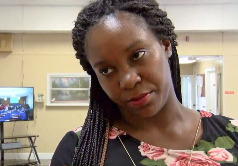 Britany Jacobs speaks with a reporter following a vigil for Markeis McGlockton.