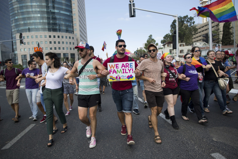Image: LGBT community members block a highway during a protest in Tel Aviv