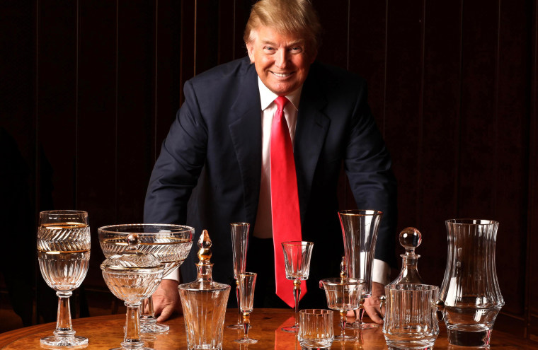 Donald Trump with his latest project, a tabletop collection called Trump Home by Rogask, that includes six patterns of a ornately cut modern crystal-and-gold combination, in a board room at the Trump Tower in New York.