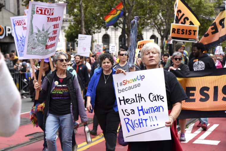 Image: Health care activists march in the San Francisco Gay Pride parade on June 25, 2017 in San Francisco.