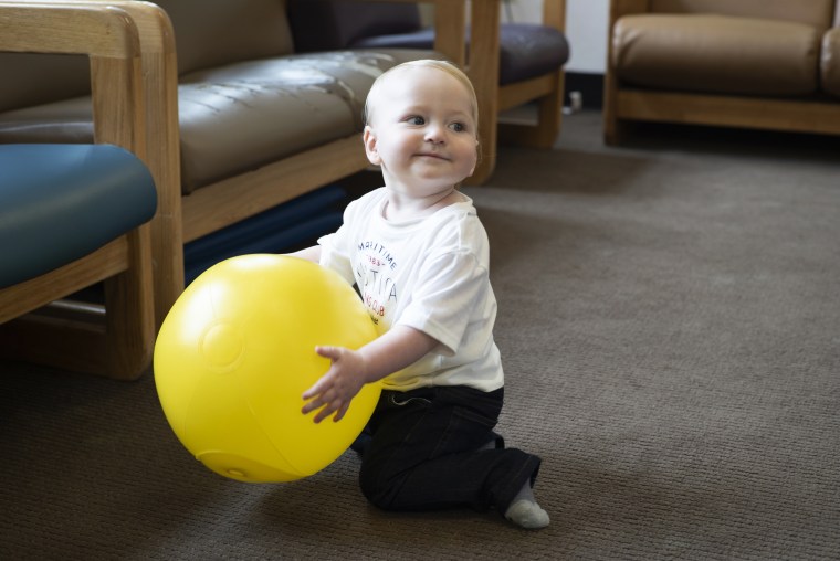 Image: Lindsay Landon's son Gabriel plays with a plastic ball inside a playroom in the prison nursery