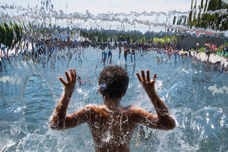 Image: A child plays in the waterfall at Yards Park in Washington