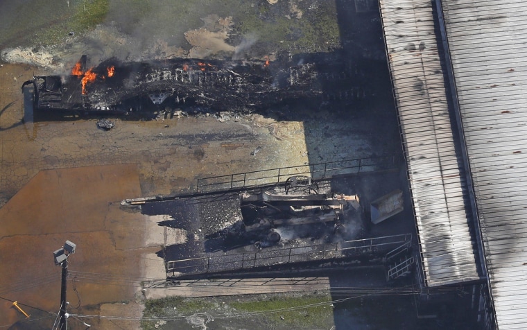 Image: A fire burns at the flooded plant of French chemical maker Arkema SA in Crosby