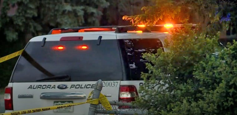Aurora, Colorado, police respond outside the house where an armed man was shot by an officer responding to a report of a home invasion.