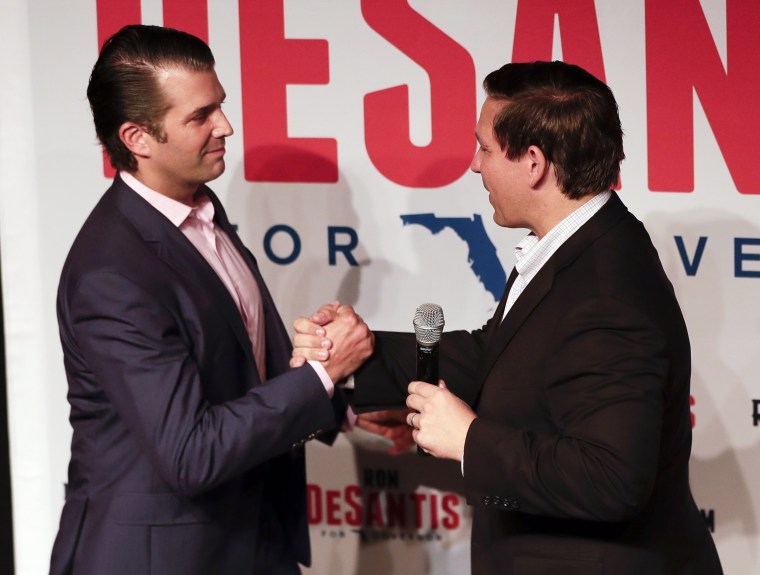 Image: Donald Trump Jr., left, greets Florida gubernatorial candidate U.S. Rep. Ron DeSantis