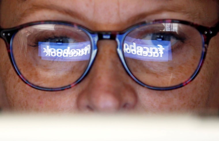 Image: FILE PHOTO: The Facebook logo is reflected on a woman's glasses in this photo illustration