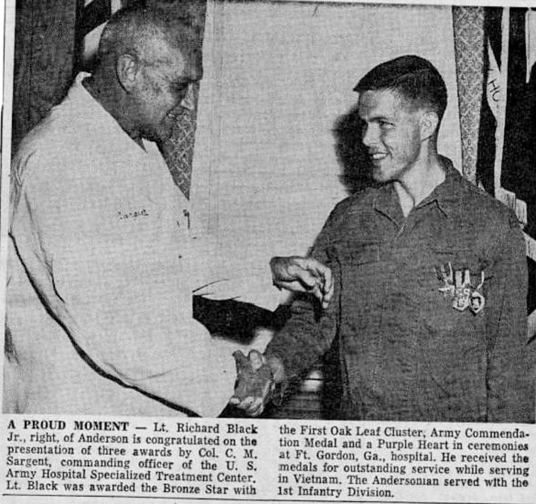 A newspaper clipping of Lt. Richard Black being awarded the bronze star.