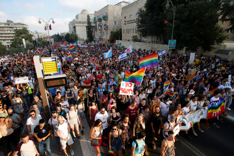 Image: A general view shows participants marching during Jerusalem's 17th annual Gay Pride Parade