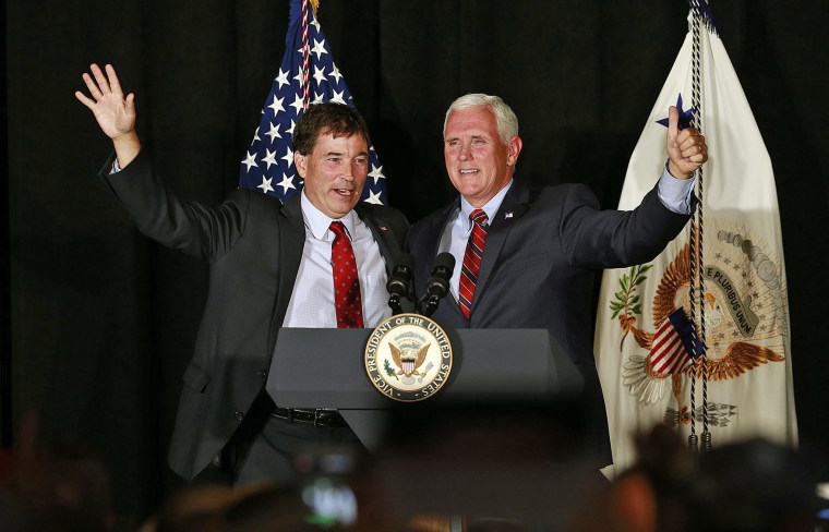 Vice President Mike Pence, right, waves to the crowd with 12th Congressional District Republican candidate Troy Balderson
