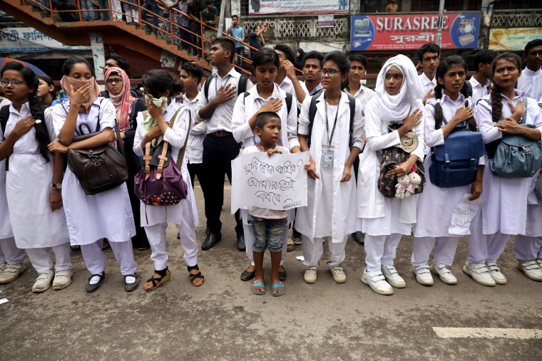Image: People and students take part in a protest over recent traffic accidents that killed a boy and a girl, in Dhaka