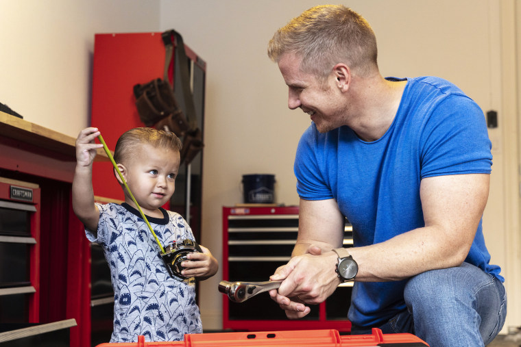 Sean Lowe and his son Samuel in their new garage by Lowe's, in partnership with Craftsman.