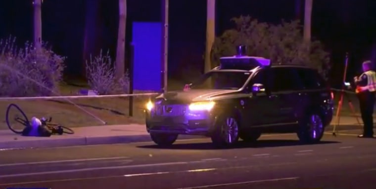 Image: Investigators at the scene of a fatal accident involving a self-driving Uber car on the street in Tempe, Arizona.