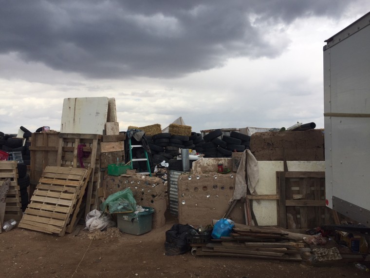 A makeshift compound in Amalia, New Mexico, harbored five adults and 11 children