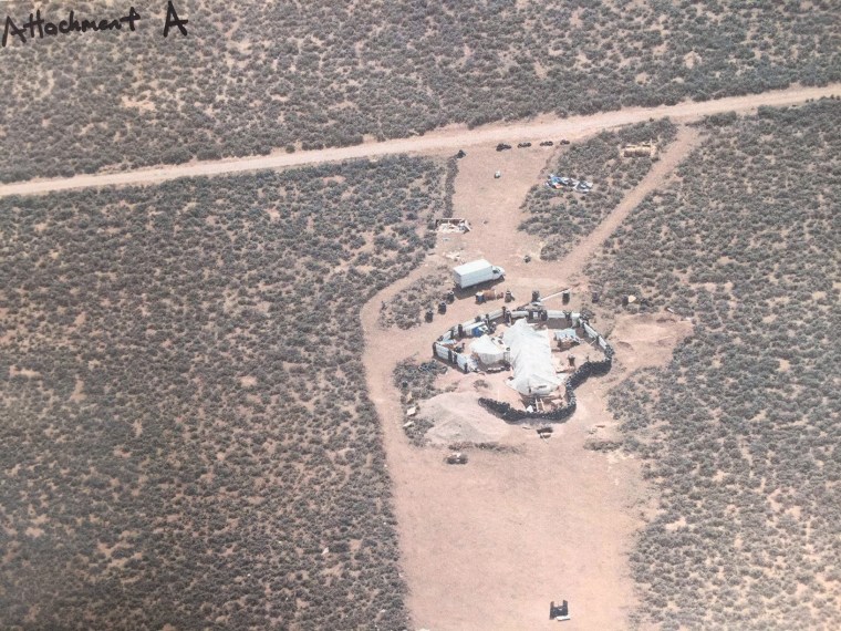 A makeshift compound in Amalia, New Mexico, harbored five adults and 11 children