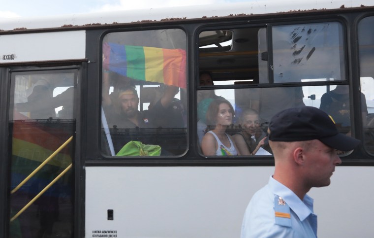 Image: Demonstrators are seen in a police bus after being detained during the LGBT community rally in central St. Petersburg