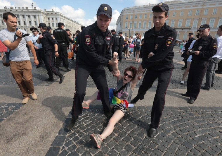 Image: A demonstrator is detained by police during the LGBT community rally in central St. Petersburg