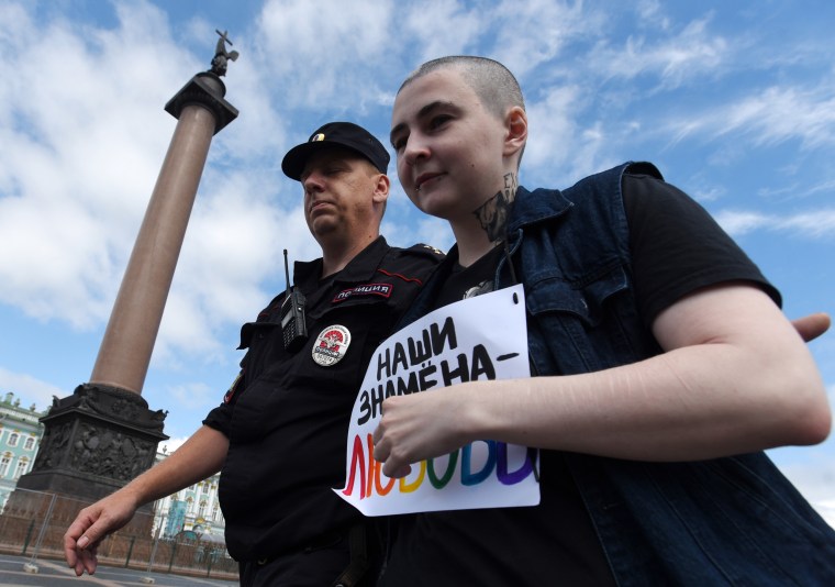 Police detain an LGBT activist during an unauthorized rally at the 9th St. Petersburg Pride Parade on Palace Square.