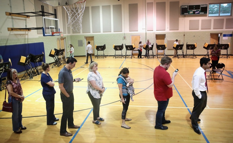 Image: Voters wait in line to cast their ballot during Ohio's 12th District special congressional election