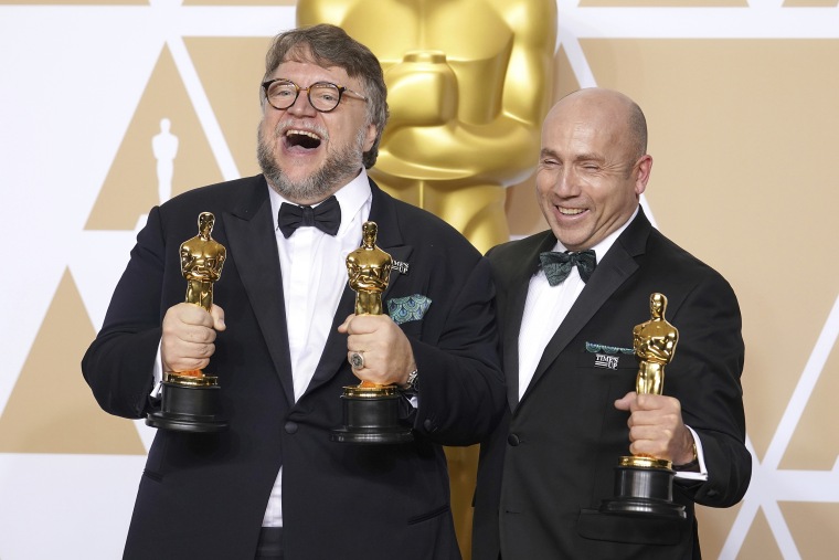 Guillermo del Toro posing in the Press Room during the 90th Academy Awards ceremony