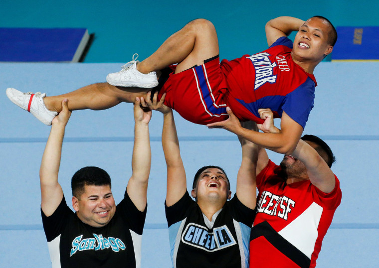 Image: Cheerleaders perform during the Gay Games at the Charlety Stadium in Paris