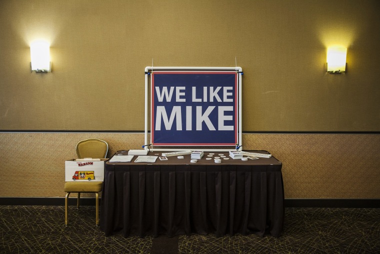 Image: Signs for Rep. Mike Capuano at a campaign event with the local carpenter's union in Somerville