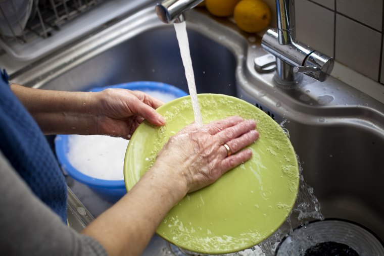 Aging hands, dry hands washing dishes
