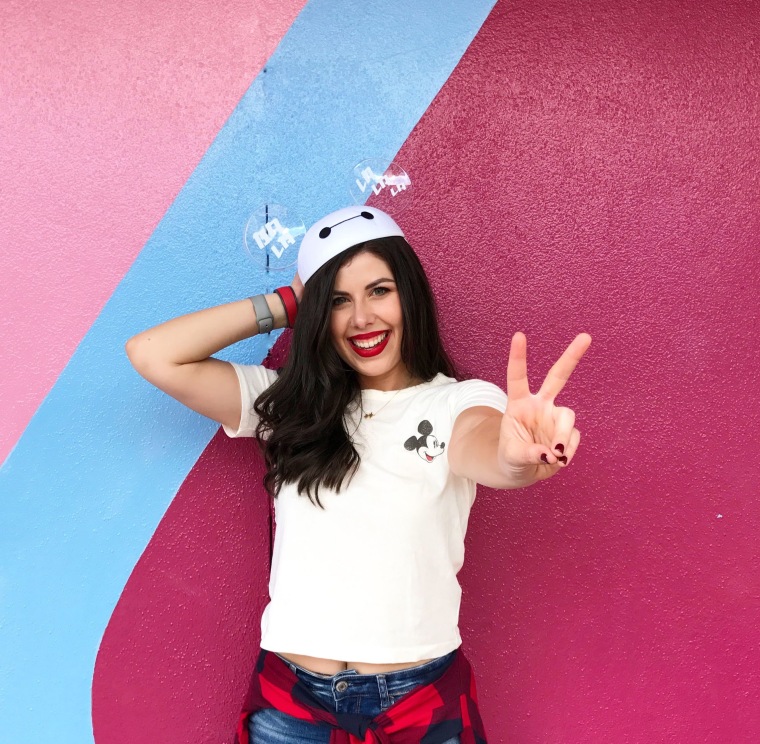 Jill Kaplan of Disney Girl Beauty poses at Epcot's Bubblegum Wall.