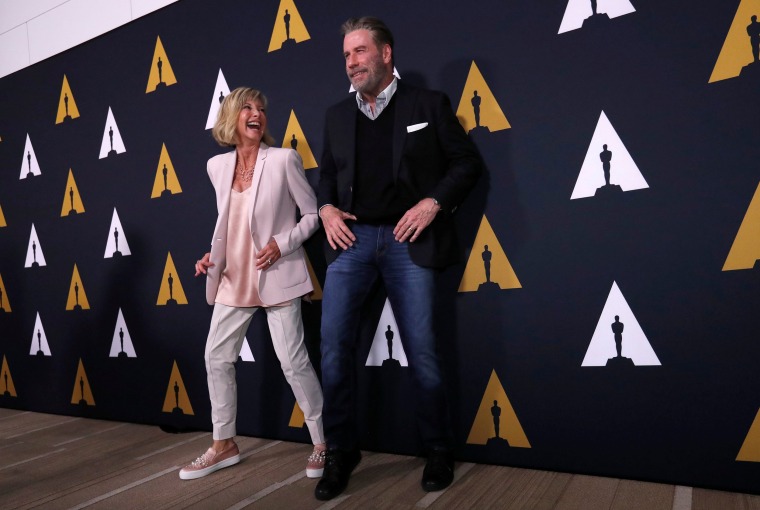 Image: Cast members Travolta and Newton-John dance at a 40th anniversary screening of "Grease" at the Academy of Motion Picture Arts and Sciences in Beverly Hills