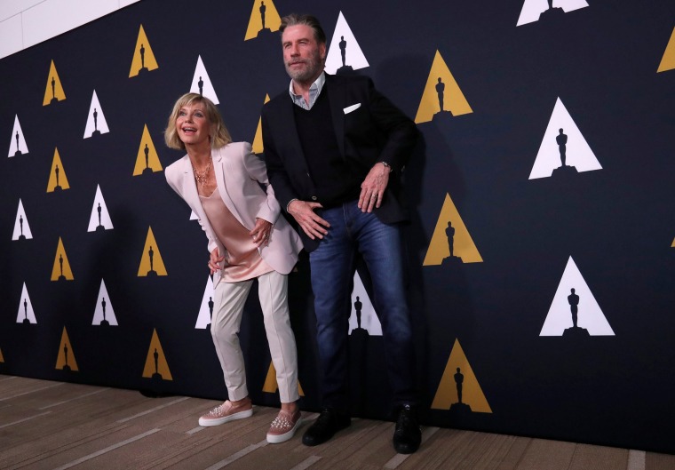 Image: Cast members Travolta and Newton-John dance at a 40th anniversary screening of "Grease" at the Academy of Motion Picture Arts and Sciences in Beverly Hills