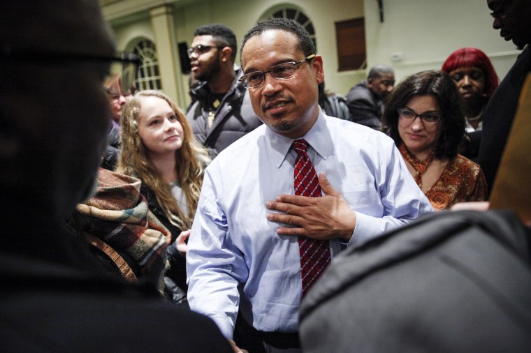Image: Rep. Keith Ellison meets supporters after a town hall meeting