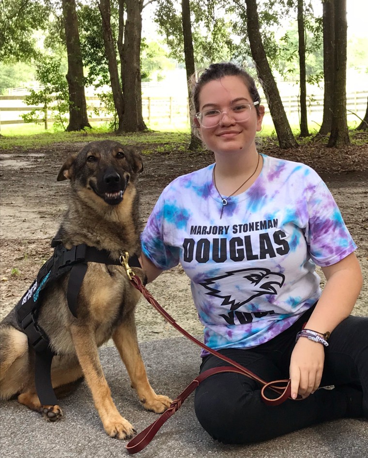 Image: Haylee Shepherd, 16, an incoming junior at Marjory Stoneman Douglas High School with her service dog, Spree.