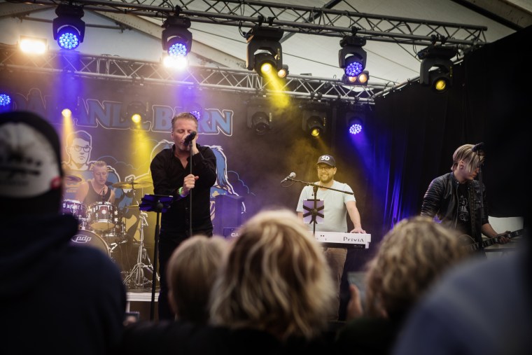 Image: Jimmie Åkesson plays keyboards in his band at the festival