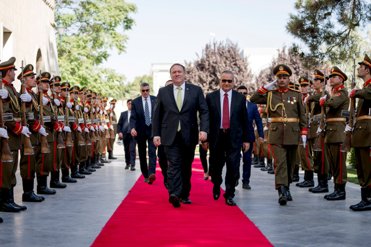 U.S. Secretary of State Mike Pompeo is greeted by Chief of Staff Abdul Salam Rahimi.