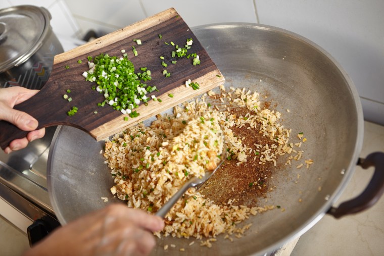 Add scallions to fried rice at the end of cooking